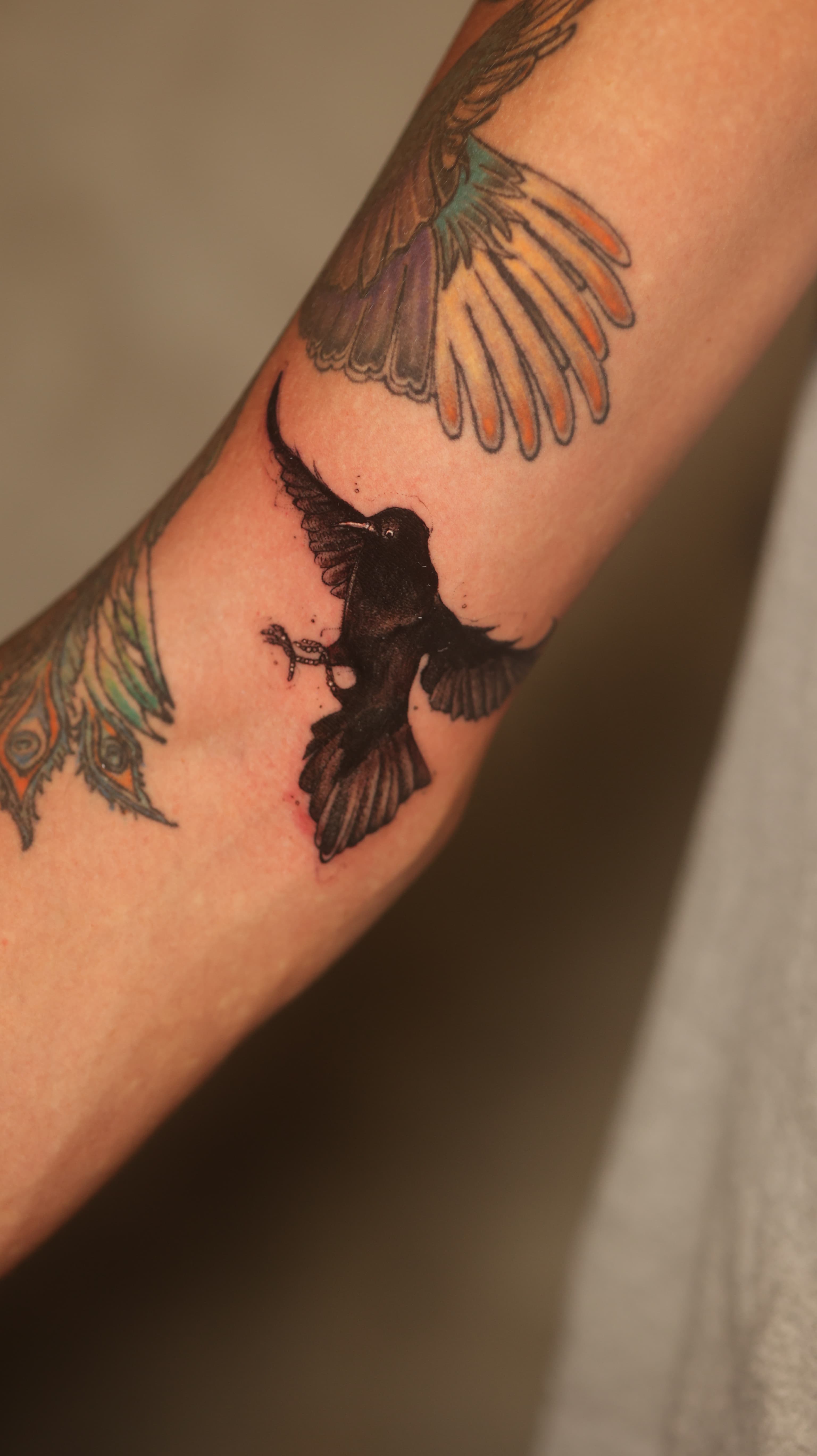 Black raven freehand tattoo by Riverón in Panama